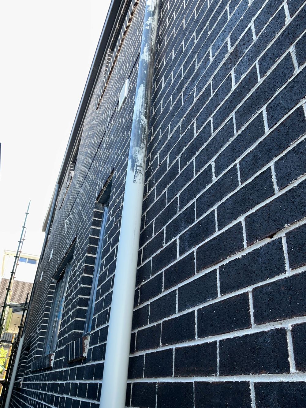 Downpipe not fixed to the wall at fixing stage, Cobbitty