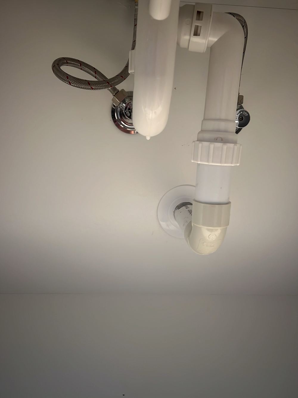 Leaking mixer pipe, found during a handover inspection in Cobbitty