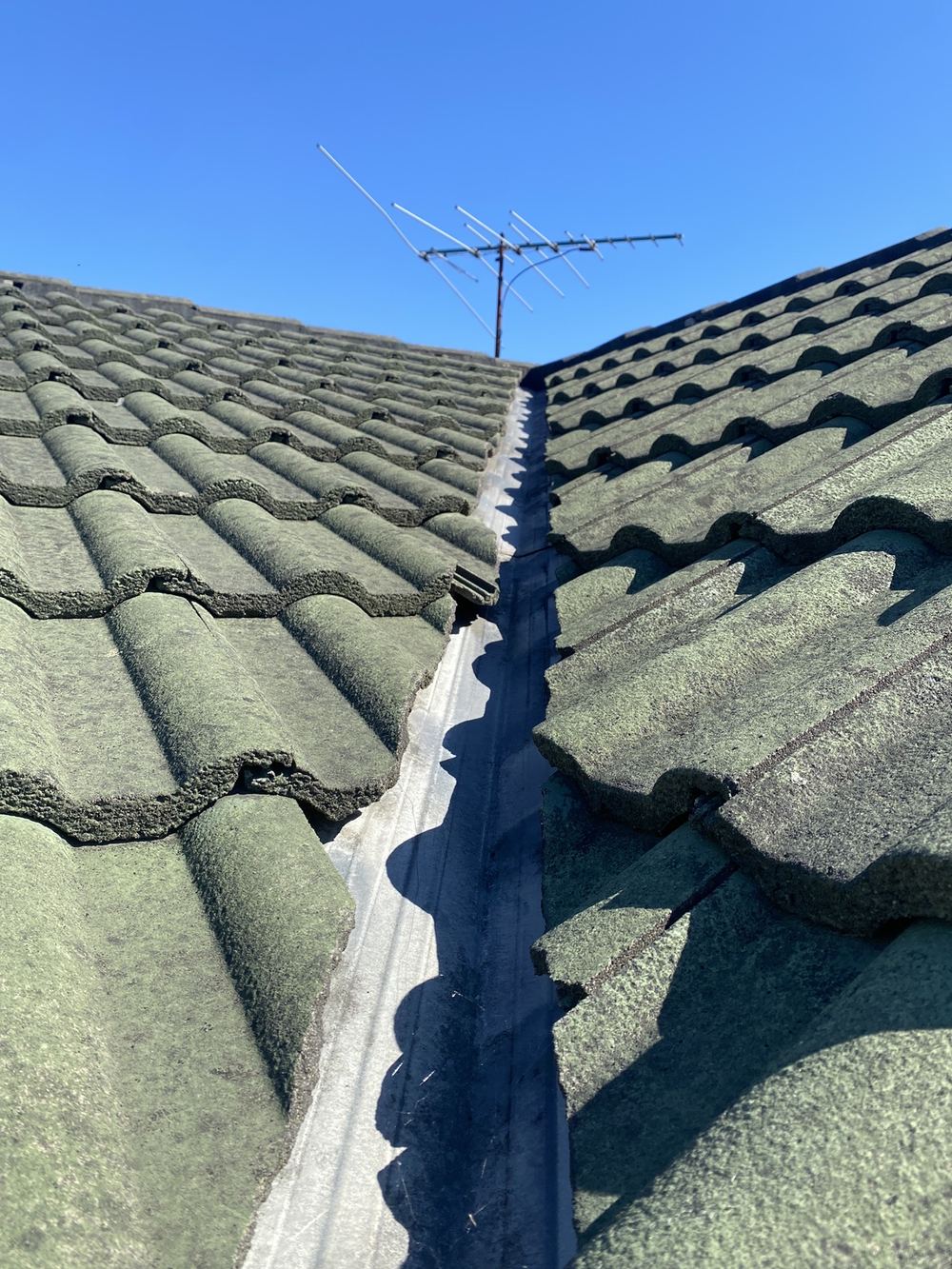 Roof tile dislodged from the valley, leaving a gap, found during a pre-purchase inspection in Horningsea Park