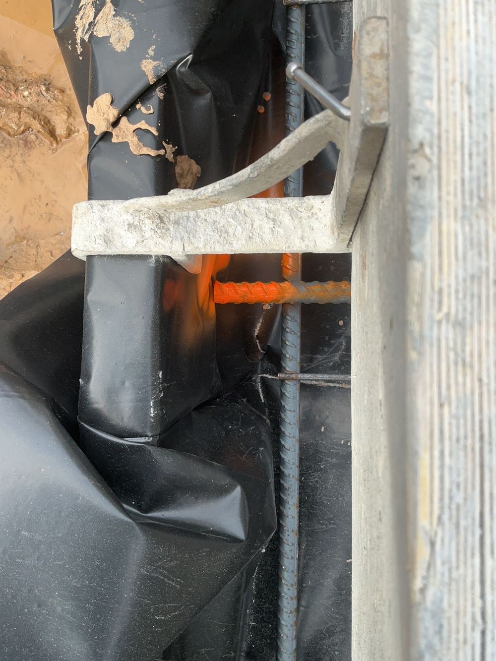 Reinforcement sitting with less concrete cover than required, found during a slab pre-pour inspection in Spring Farm